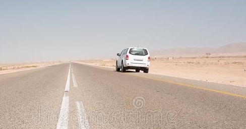 asphalt-road-straight-desert-south-oman-parked-vehicle-138262173.jpg